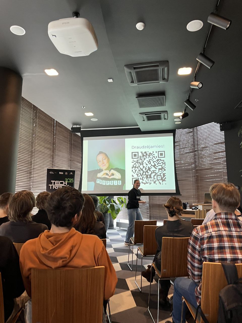 Ieva Drazniece speaking at Junior Achievement Latvia 2025